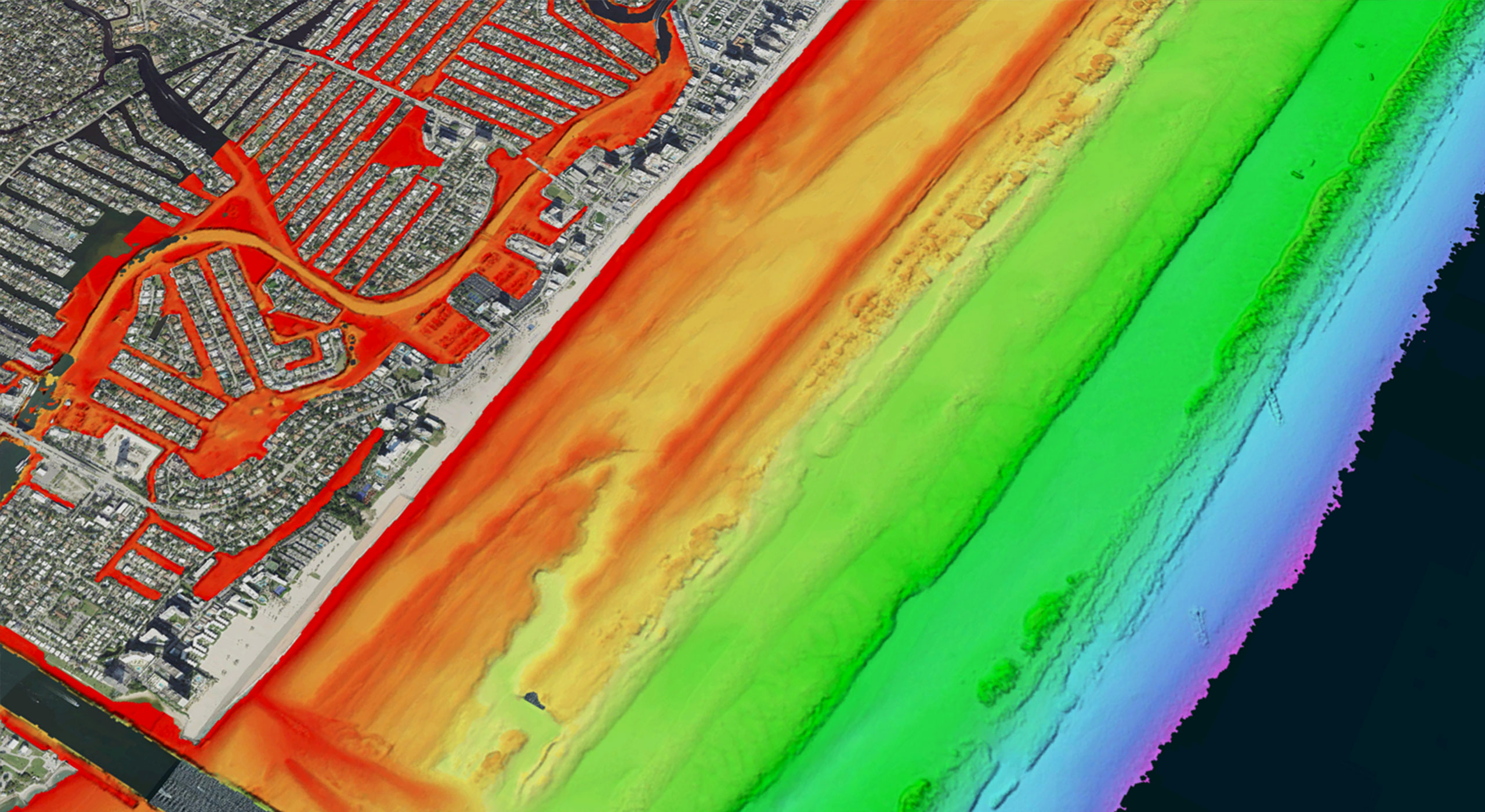 Color-coded geospatial elevation survey of a coastline created through advanced sensor development, highlighting terrain variations for precise analysis.