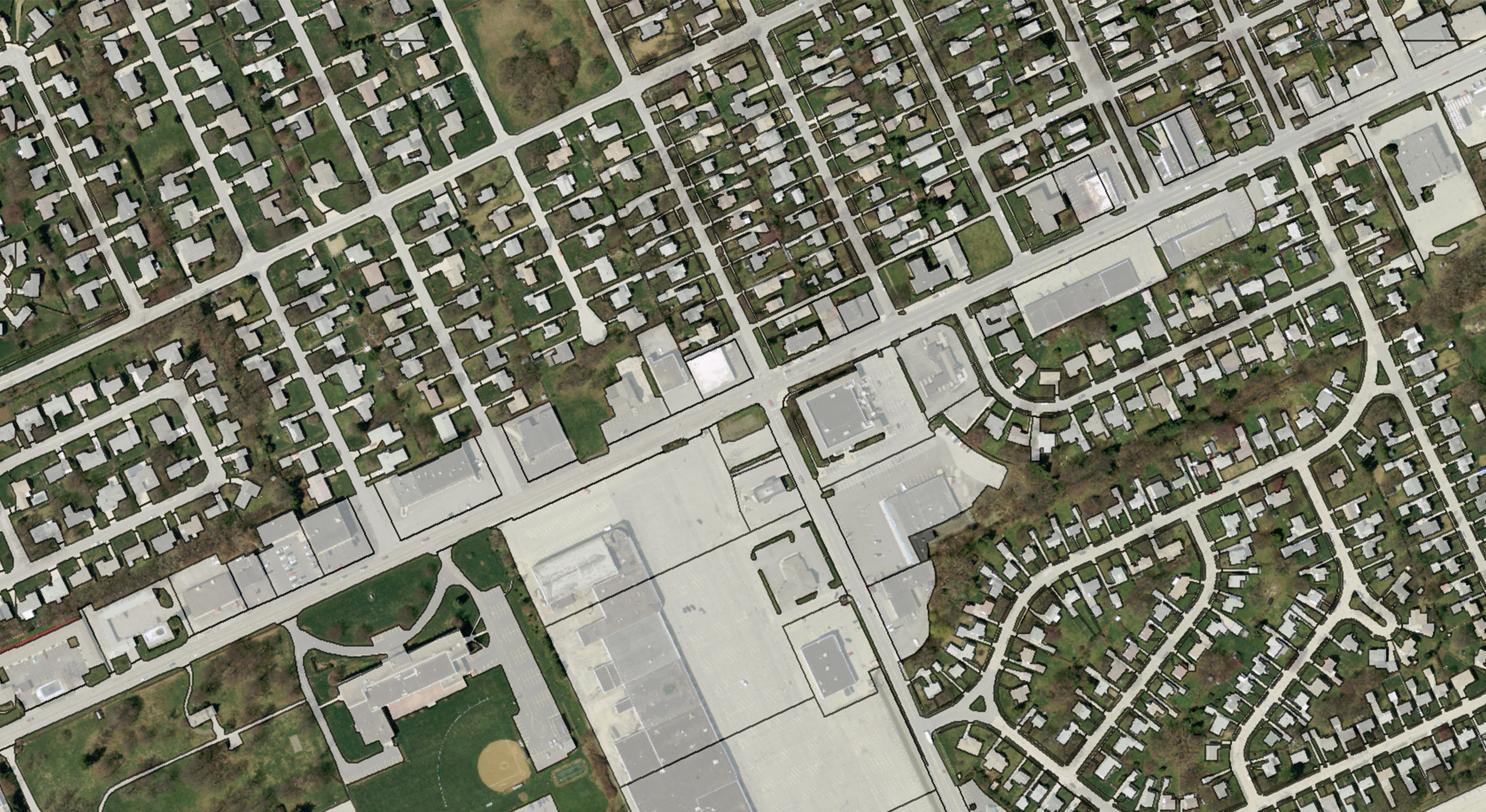 Aerial digital image of an airport and surrounding suburbs, illustrating how derivative data products deliver accurate geospatial insights for infrastructure planning.