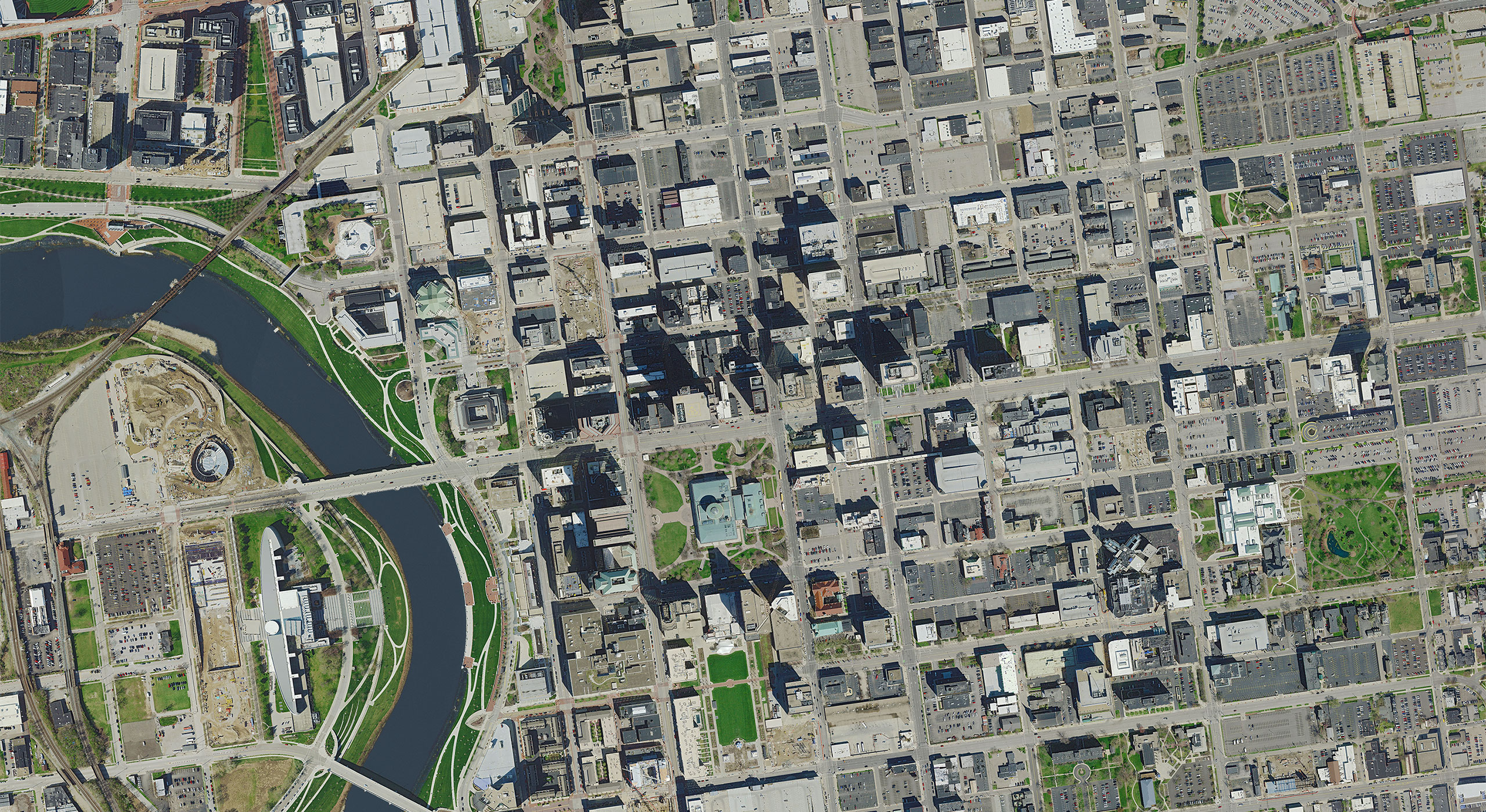 Aerial view of a city with a river, illustrating GIS mapping for urban planning and geospatial analysis.