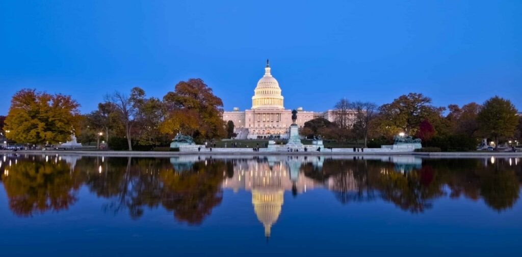 The U.S. Capitol building reflected in the Capitol Reflecting Pool in Washington, D.C., representing federal policy and infrastructure funding discussions related to WRDA 2026.